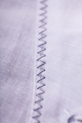 Image showing Closeup Small Buttons on White Cloth