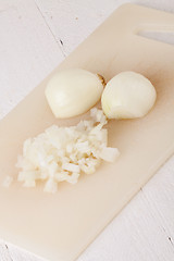 Image showing Whole, peeled and diced brown onion