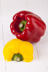 Image showing Red and Yellow Peppers on White Background