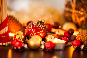 Image showing Warm gold and red Christmas candlelight background