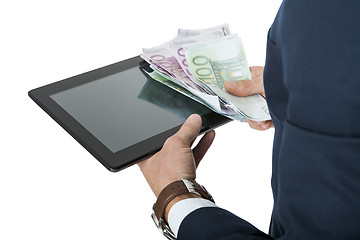 Image showing Businessman using a tablet computer