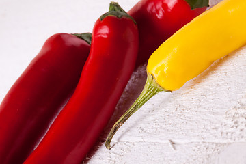 Image showing Fresh red and yellow chili peppers with spice