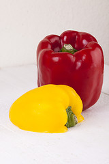 Image showing Red and Yellow Peppers on White Background