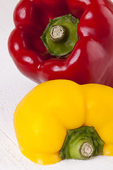 Image showing Red and Yellow Peppers on White Background