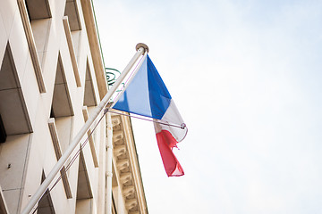 Image showing Flag of France fluttering under a serene blue sky