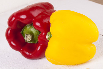 Image showing Red and Yellow Peppers on White Background