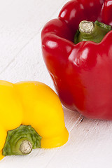 Image showing Red and Yellow Peppers on White Background