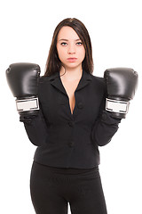 Image showing Young brunette wearing boxing gloves