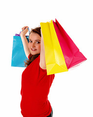 Image showing Girl lifting shopping bag's.