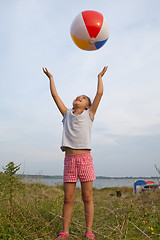 Image showing Little girl playing with a ball outdoors