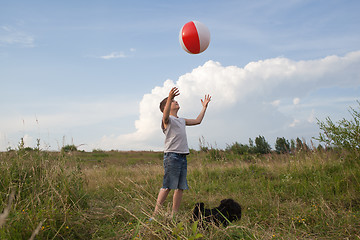 Image showing Young boy playing with a ball outdoors