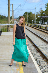 Image showing Walking girl on platform