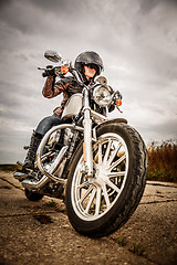 Image showing Biker girl on a motorcycle