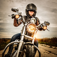 Image showing Biker girl on a motorcycle