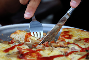 Image showing Eating pizza