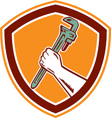 Image showing Hand Holding Adjustable Wrench Shield Woodcut