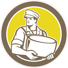 Image showing Cheesemaker Holding Parmesan Cheese Circle