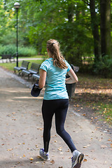 Image showing Young female jogger