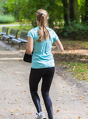 Image showing Young female jogger