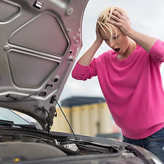 Image showing Stressed Young Woman with Car Defect.