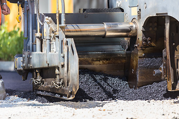 Image showing Asphalt surfacing manual labor.