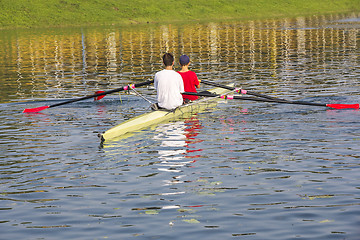 Image showing Two rowers in a boat