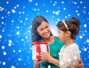 Image showing happy mother and child girl with gift box