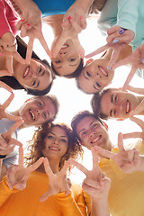 Image showing group of smiling teenagers showing victory sign