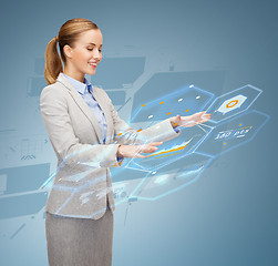 Image showing smiling businesswoman working with virtual screen