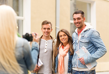 Image showing group of smiling friends taking photo outdoors