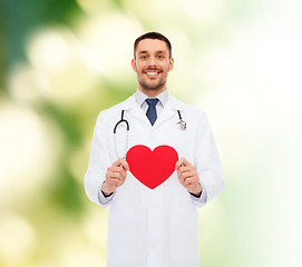 Image showing smiling male doctor with red heart