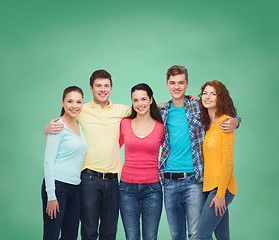 Image showing group of smiling teenagers over green board