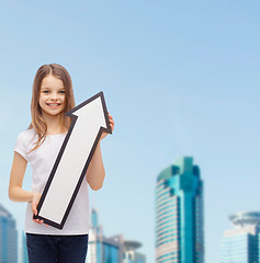 Image showing smiling little girl with blank arrow pointing up