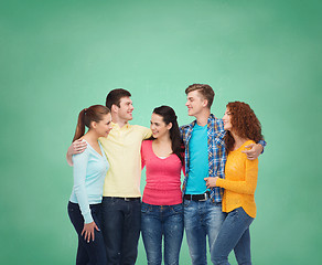 Image showing group of smiling teenagers over green board