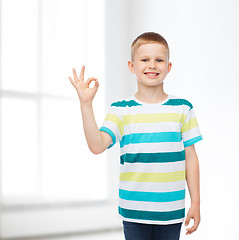 Image showing little boy in casual clothes making ok gesture