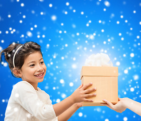 Image showing smiling little girl with gift box