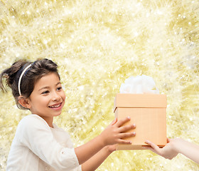 Image showing smiling little girl with gift box