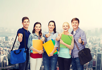 Image showing group of smiling students showing thumbs up