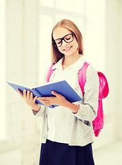 Image showing girl reading book at school