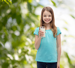 Image showing smiling little girl with glass of milk