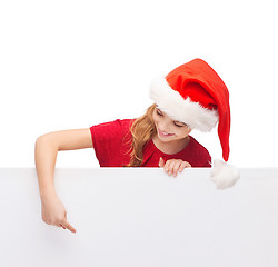 Image showing child in santa helper hat with blank white board