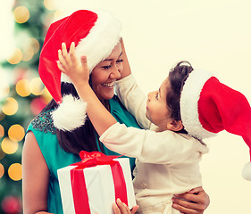 Image showing happy mother and child girl with gift box