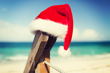 Image showing close up of santa helper hat on beach