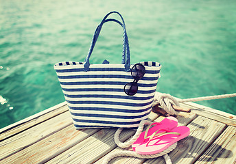 Image showing close up of beach accessories on wooden pier