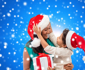 Image showing happy mother and child girl with gift box