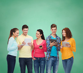 Image showing group of teenagers with smartphones and tablet pc
