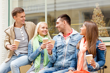 Image showing group of smiling friends with take away coffee