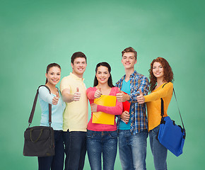 Image showing group of smiling teenagers showing thumbs up