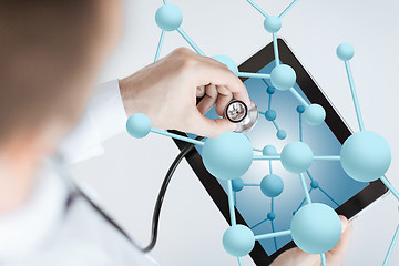 Image showing close up of doctor with stethoscope and tablet pc