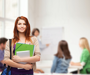 Image showing smiling student with bag, folders and tablet pc